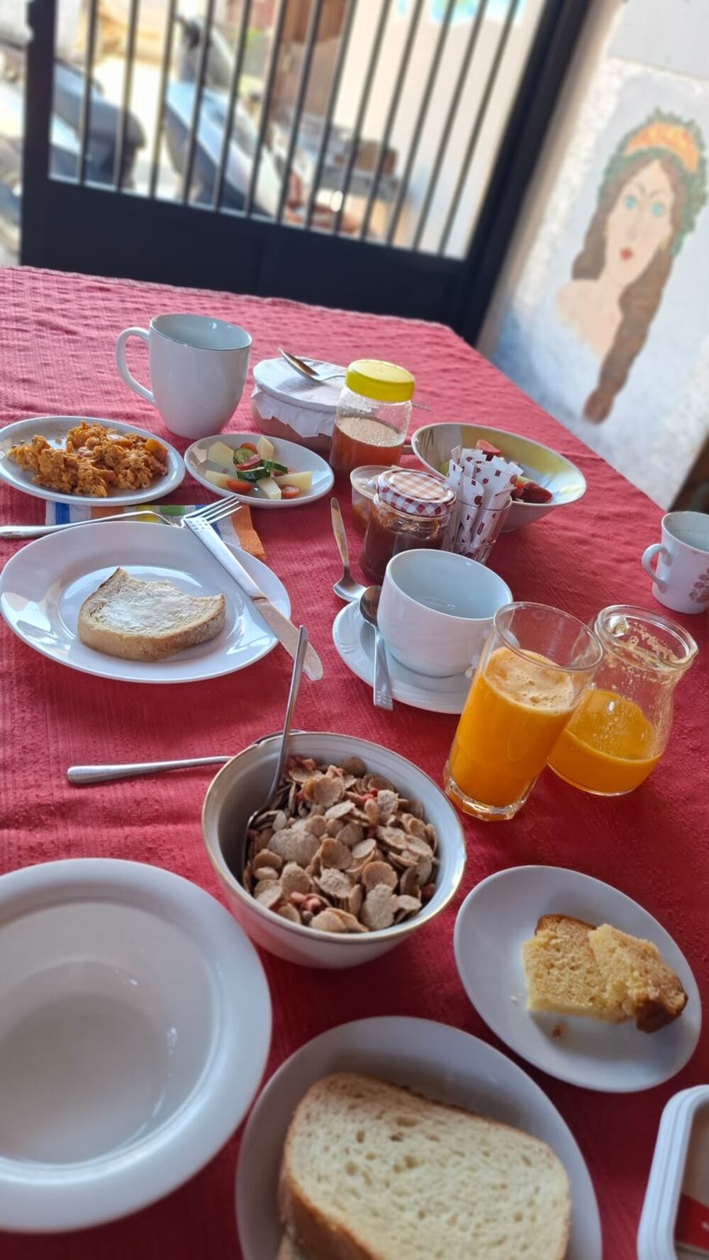 Breakfast with fresh orange juice, homemade jam, cake and garden fruit