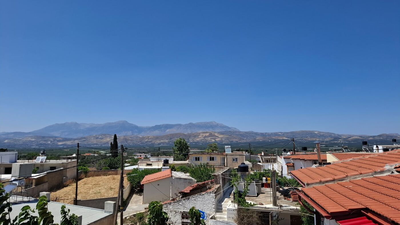 View over Vagionia village and the Messara plain to Psiloritis